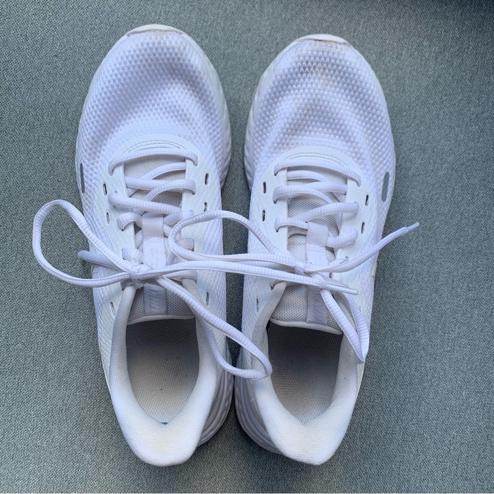 White Nike running shoes